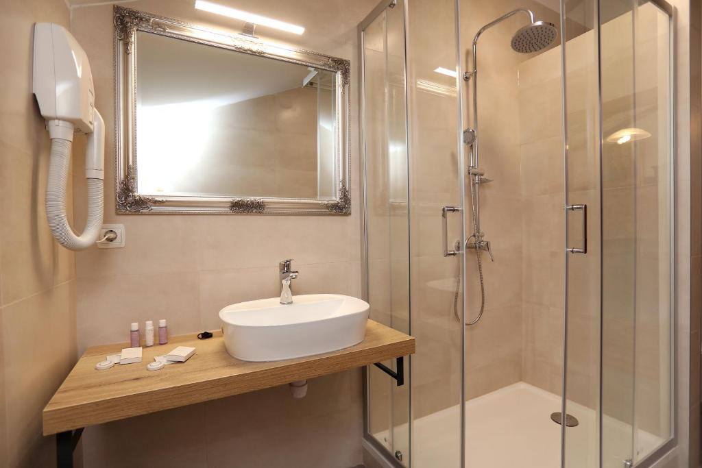 Renovated bathroom with walk-in shower at Villa Carrara